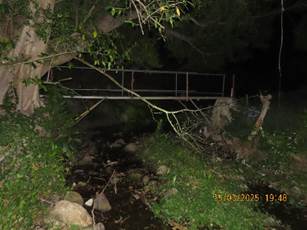 A bridge over a stream at night

AI-generated content may be incorrect.