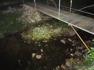 A bridge over a stream

AI-generated content may be incorrect.